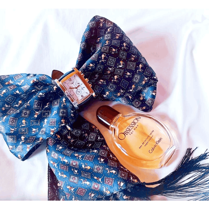 Calvin Klein Obsession for Men Oriental Woody EDT spray, showing the cologne bottle with its distinctive design.