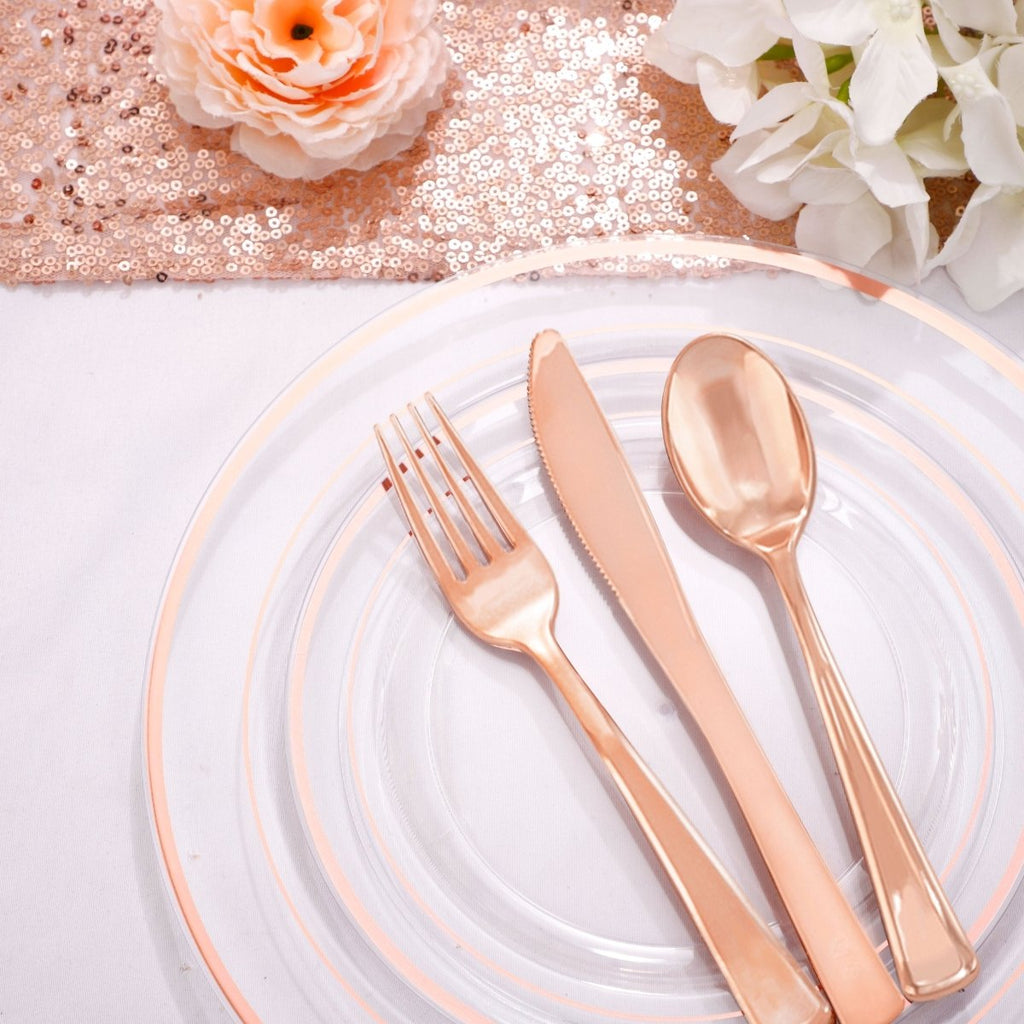 DaYammi 350pc rose gold plastic dinnerware set with plates, cups, and cutlery for parties and gatherings.