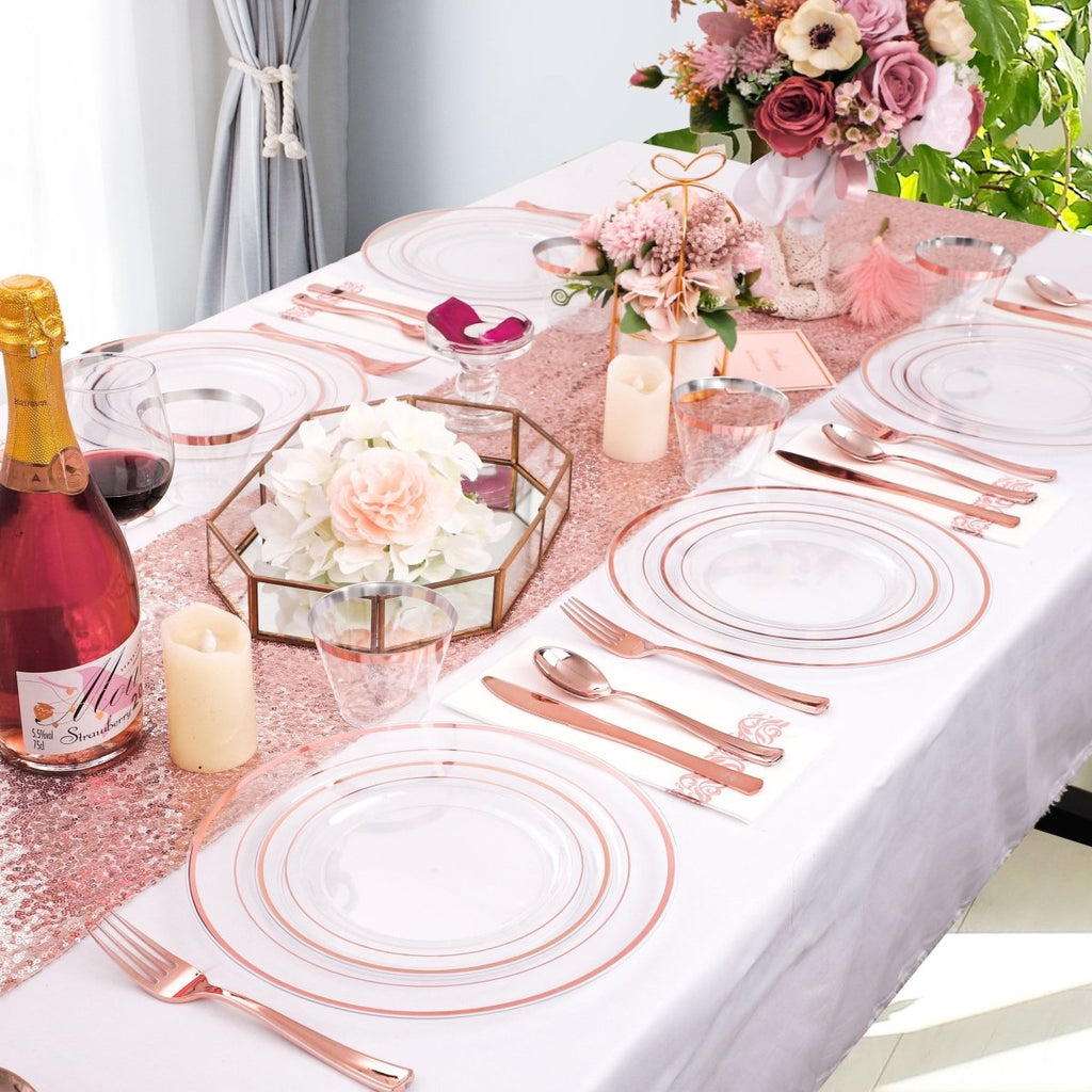 DaYammi 350-piece rose gold plastic dinnerware set including plates, cups, cutlery, and napkins for elegant dining.