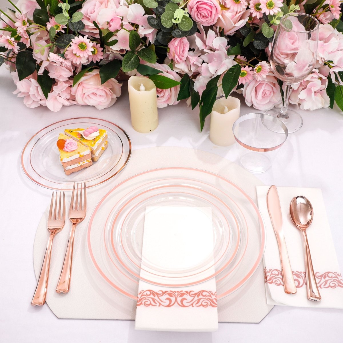 DaYammi 350-piece rose gold plastic dinnerware set with plates, cups, and cutlery for parties and gatherings.