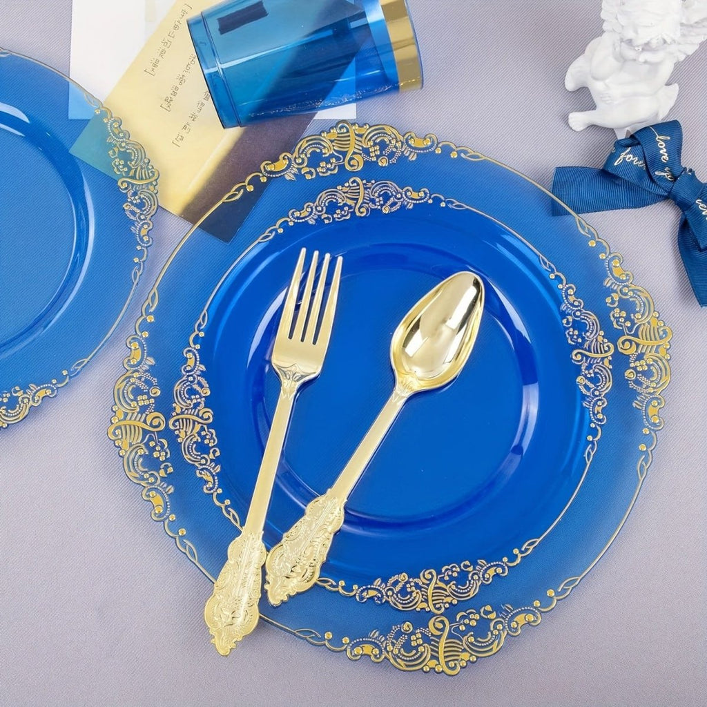 Blue plastic dinnerware set with 50 plates, cups, napkins, and gold silverware for parties and gatherings.