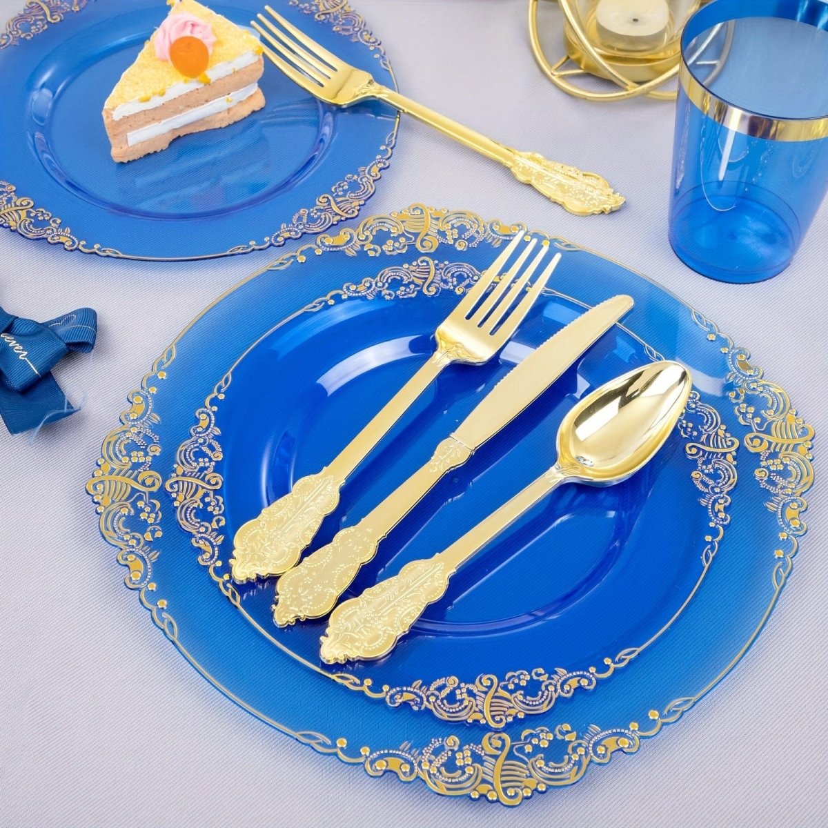 Set of 350 blue plastic plates and dinnerware for 50 guests, including cups, napkins, and gold silverware for weddings and parties.