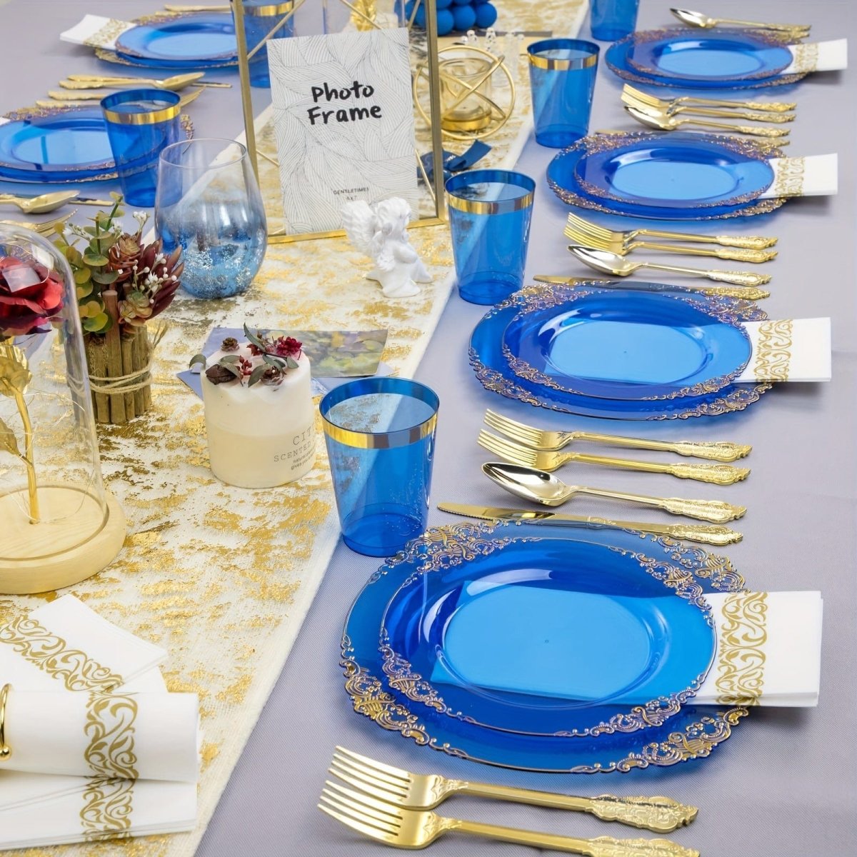 Blue plastic dinner plates and cups set for 50 guests, including disposable tableware and napkins for wedding celebrations.