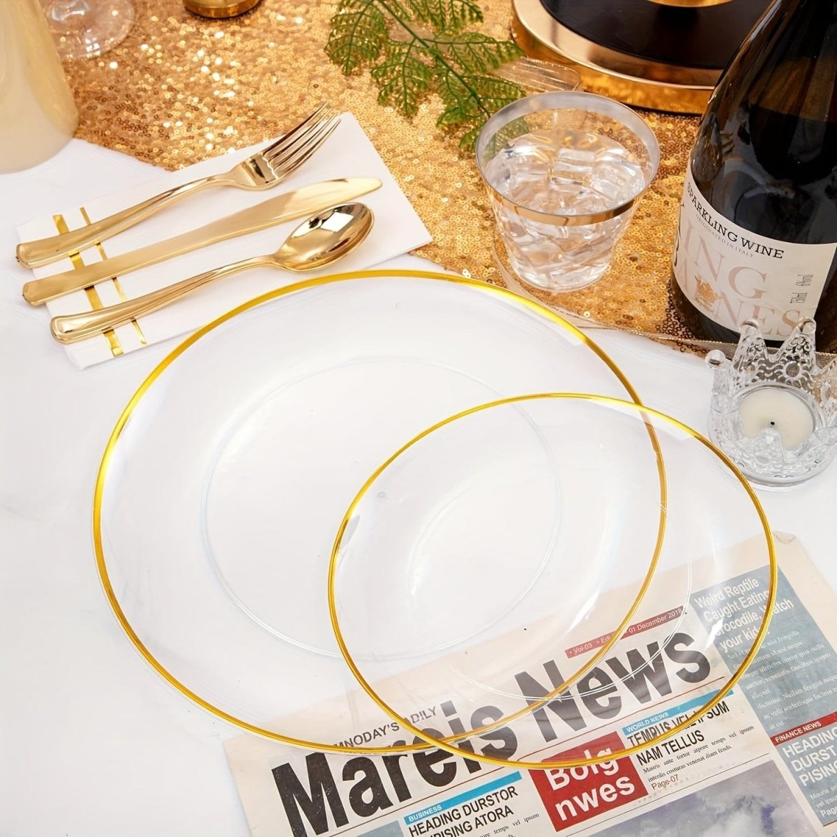 Showlu Fashion Store WDF 350-piece gold plastic cutlery and dinnerware set with plates, cups, napkins for 50 guests.