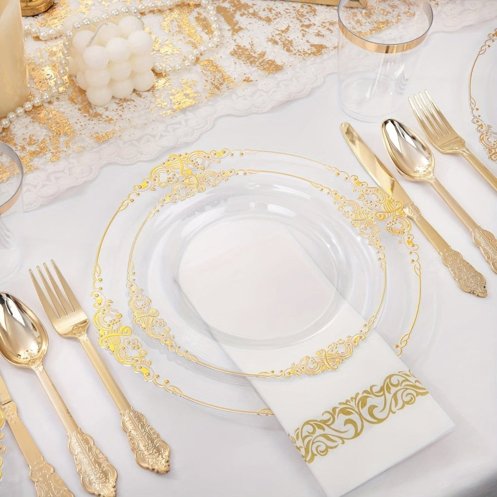 Nervure 350pc gold plastic dinnerware set with disposable plates, cups, silverware, and napkins for 50 guests, ideal for events.