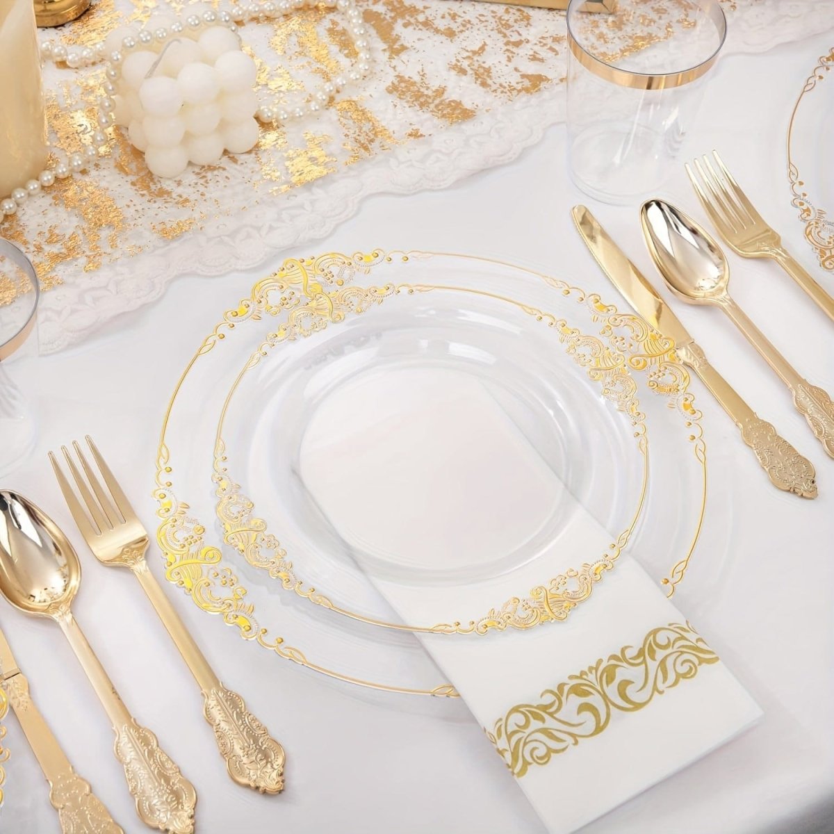 Nervure 350pc gold plastic dinnerware set with disposable plates, cups, silverware, and napkins for 50 guests, ideal for events.