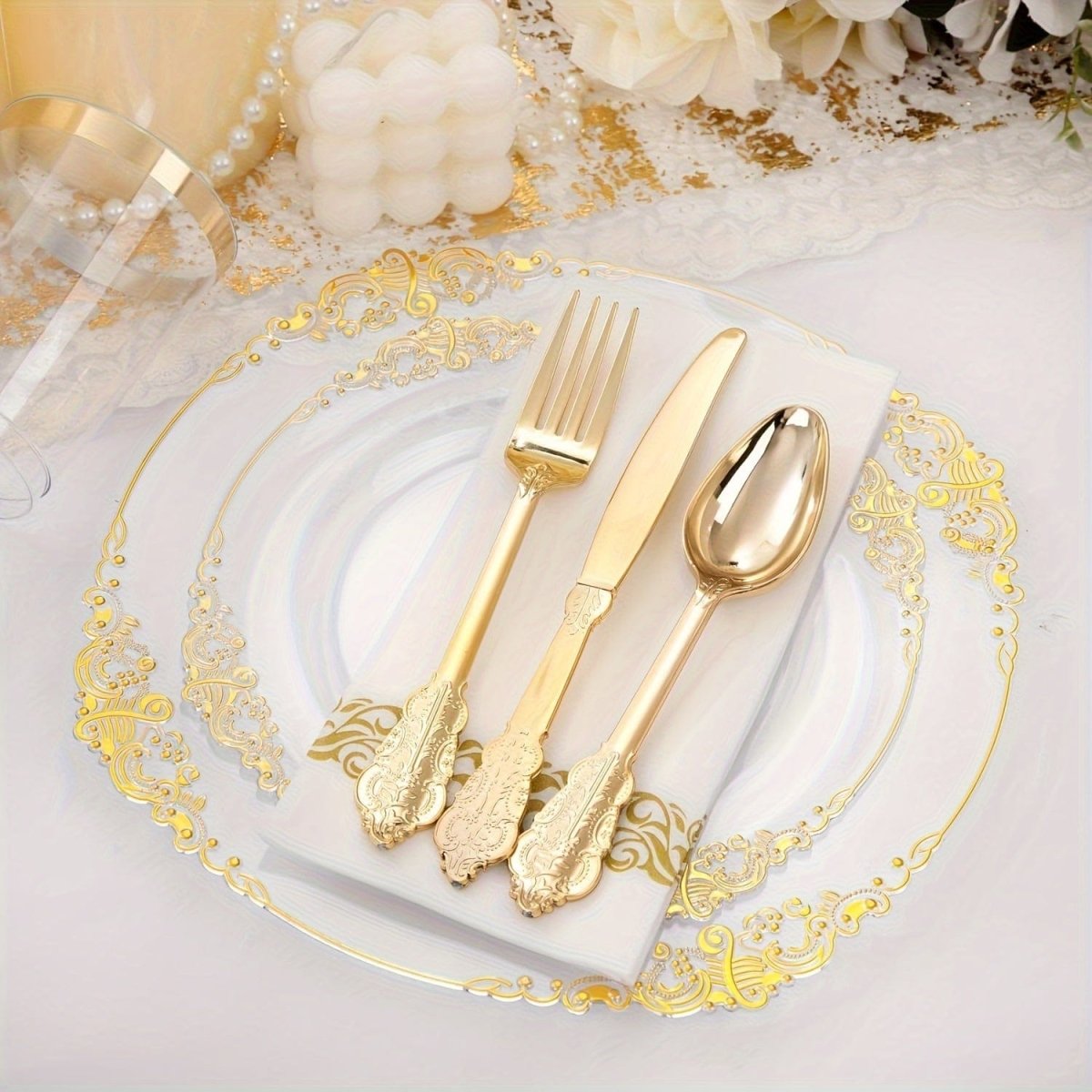 Nervure 350-piece gold plastic dinnerware set with disposable plates, cups, napkins, and silverware for 50 guests at events
