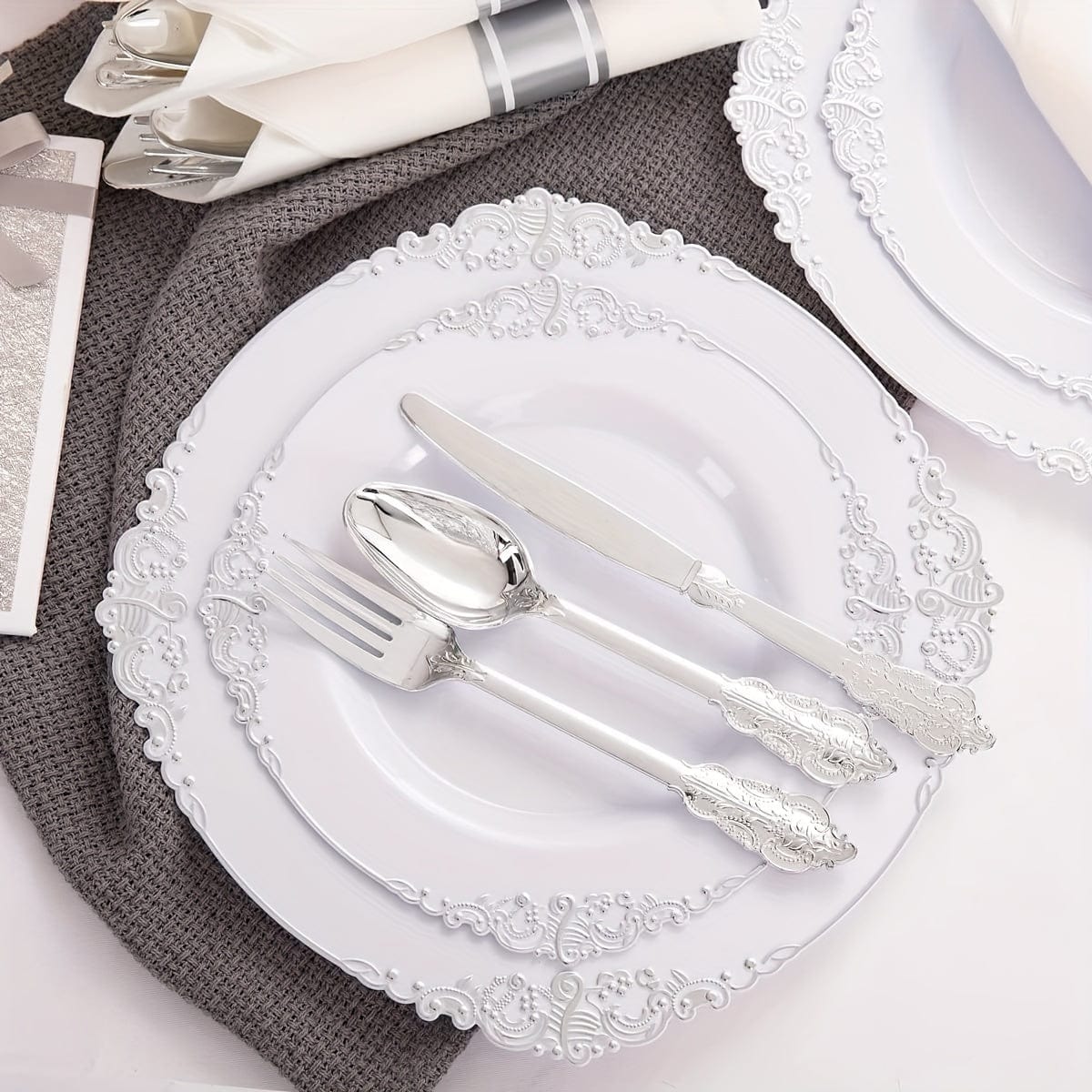 Liacere 350-piece silver plastic dinnerware set with plates, cups, napkins, and silverware for 50 guests.