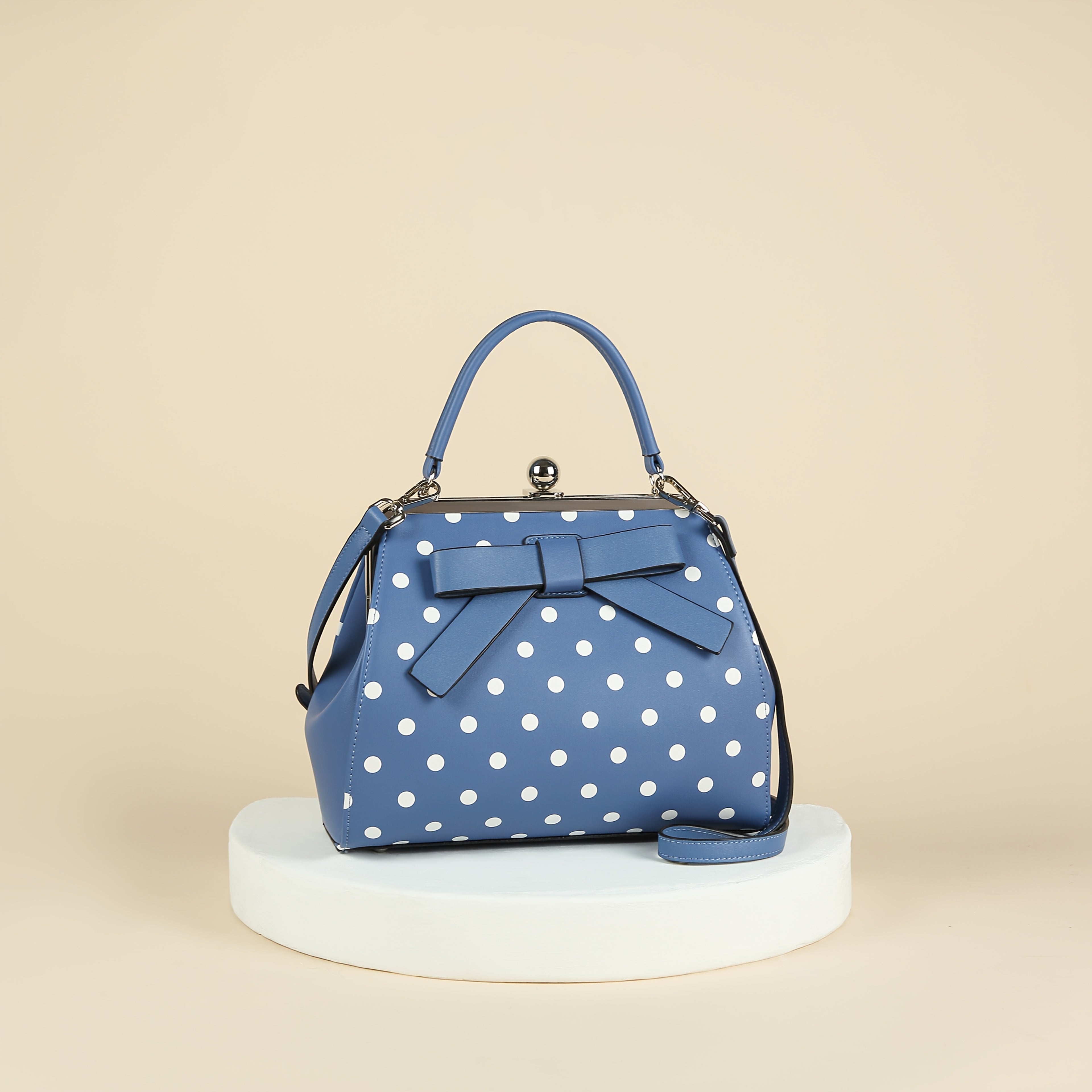 SHOWLU polka dot patent leather handbag with bow and kiss lock closure, featuring a stylish design and shiny finish