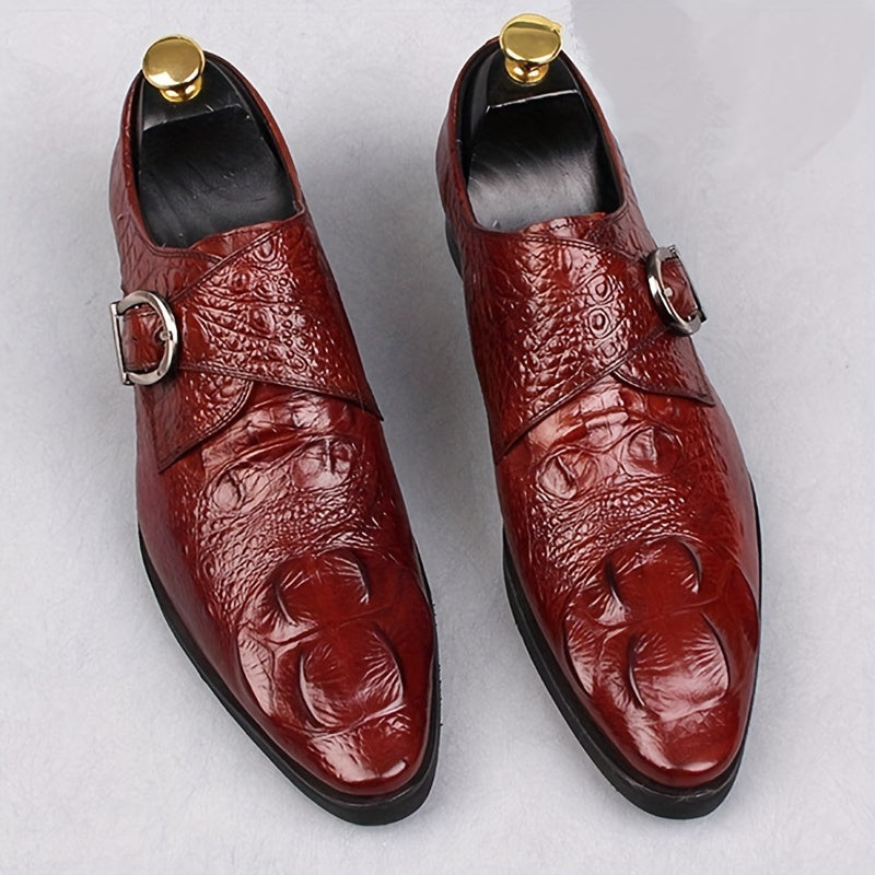 A pair of glossy red men's pointed-toe loafers with a crocodile print and a side metal buckle.