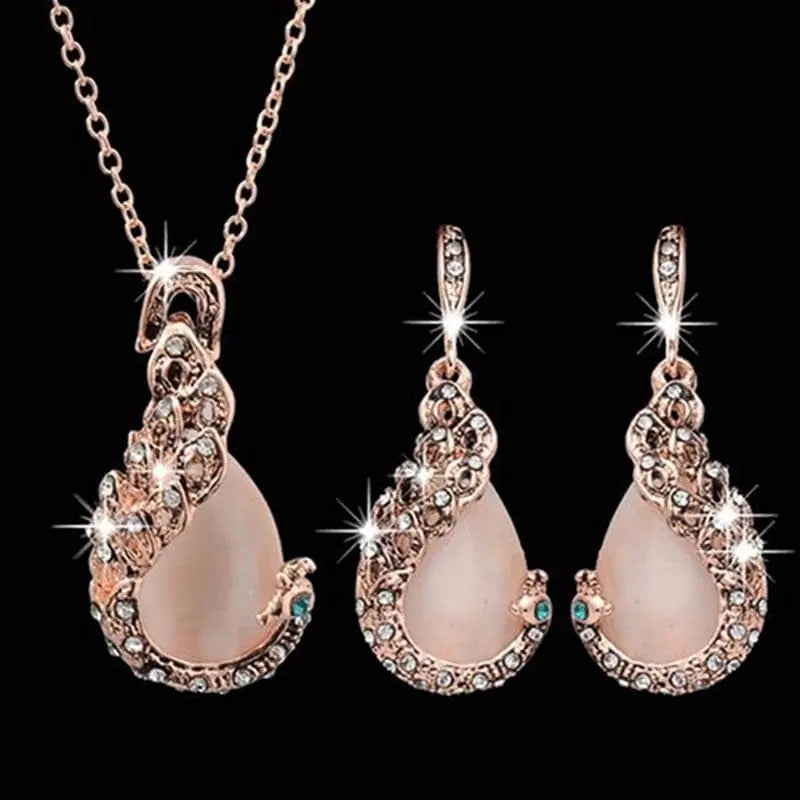 Showlu Fashion women's waterdrop rhinestone necklace and earrings jewelry set with elegant pendant and hook earrings.