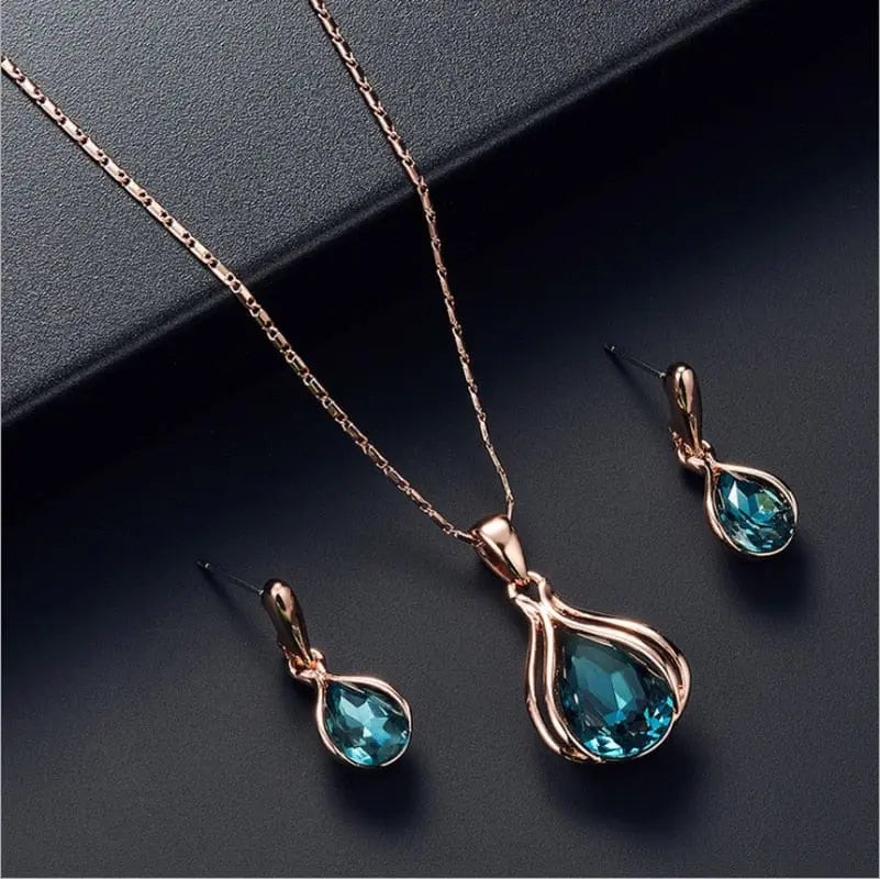Showlu Fashion women's waterdrop rhinestone necklace and earrings jewelry set with elegant pendant and hook earrings for women.