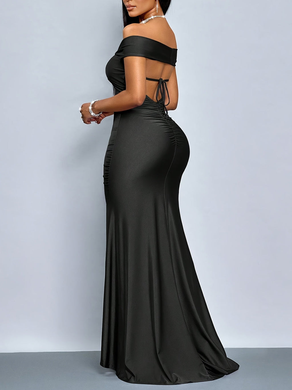Off-the-shoulder black bodycon dress with side slit by SHOWLU FASHION, fitted style showcasing sleek, elegant design.