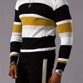 Men's striped ribbed knit sweater with long sleeves and crew neck, featuring a stylish design in neutral colors.