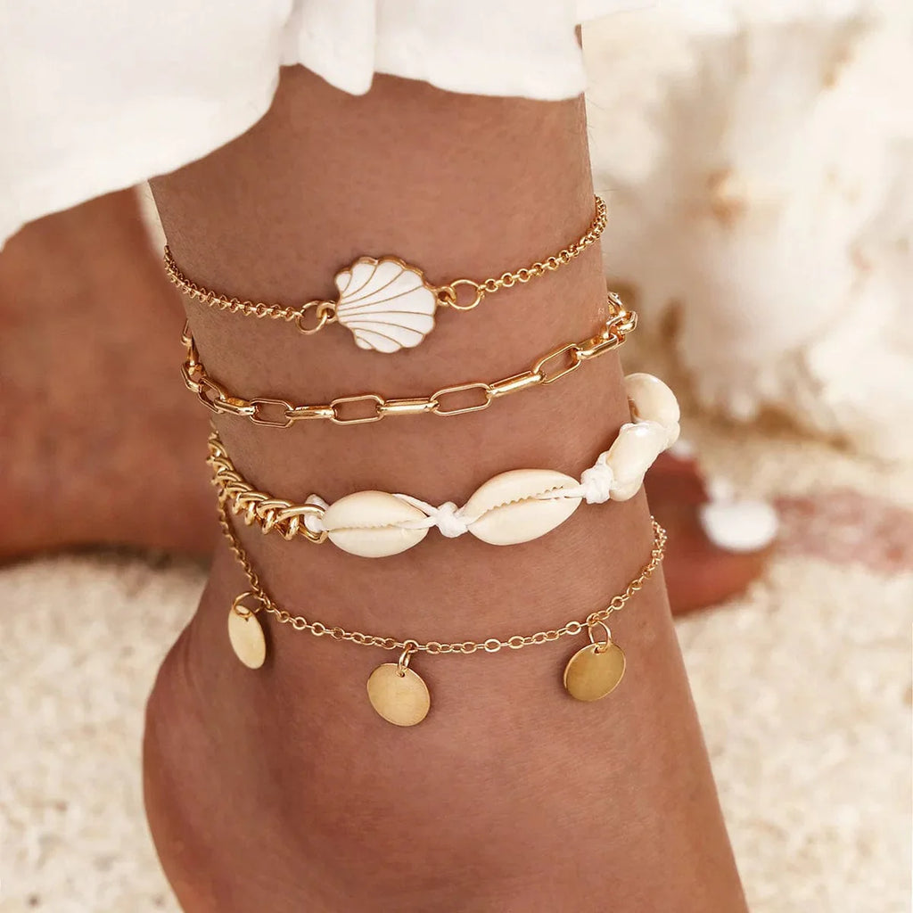 Set of four DAIPAN Bohemia shell chain anklets with crystal accents, stylish summer beach jewelry for women.