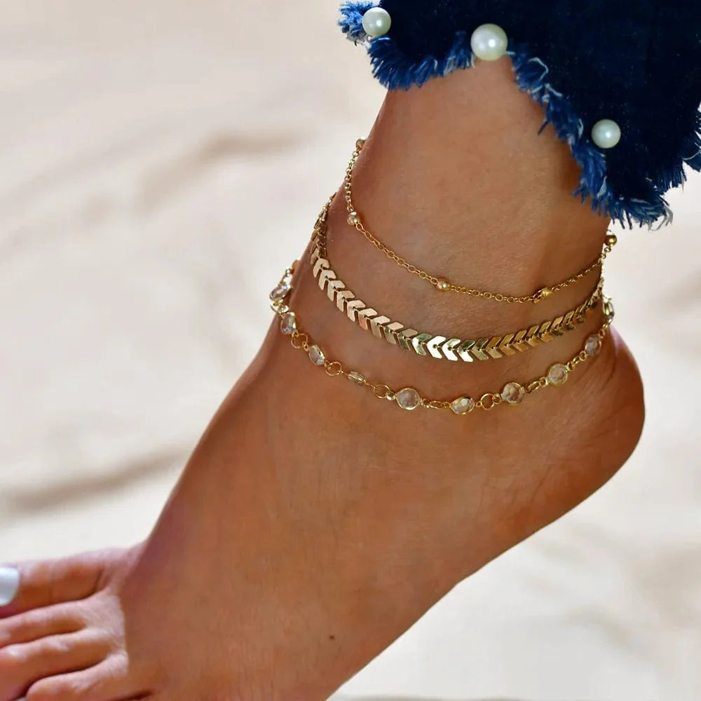 Set of four DAIPAN Bohemia shell chain anklets with crystal accents, stylish beach jewelry for women, perfect for summer and casual wear.