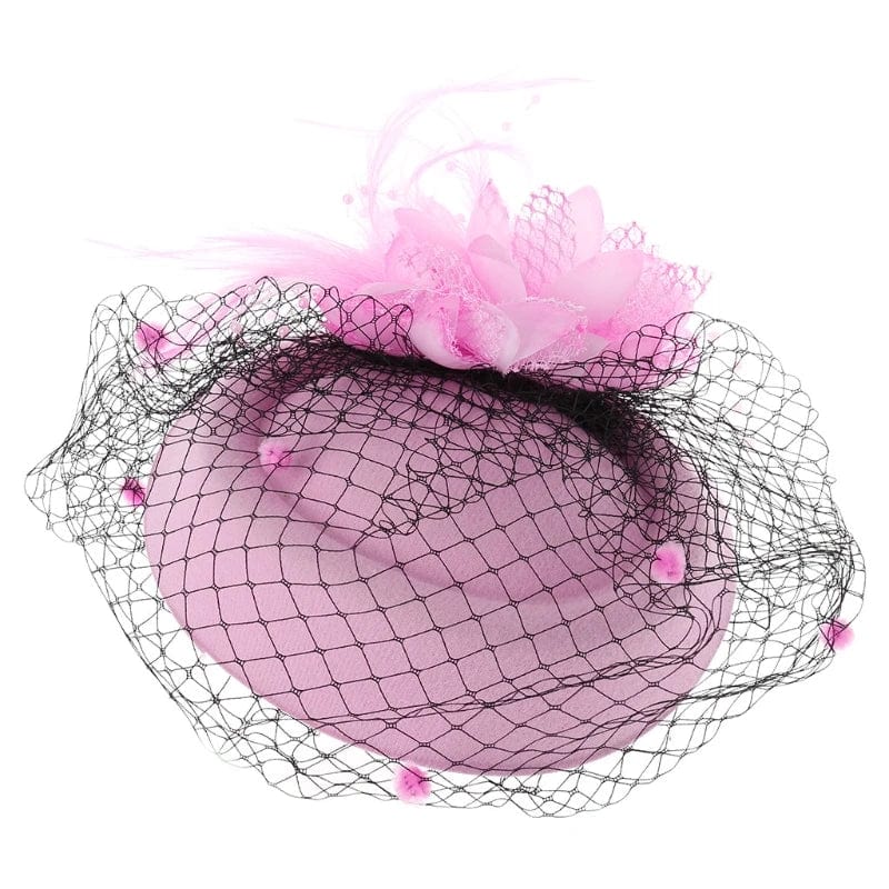 Women's fascinator hat by Showlu Fashion with feather flower design, pillbox style, veil, suitable for tea parties and special occasions.