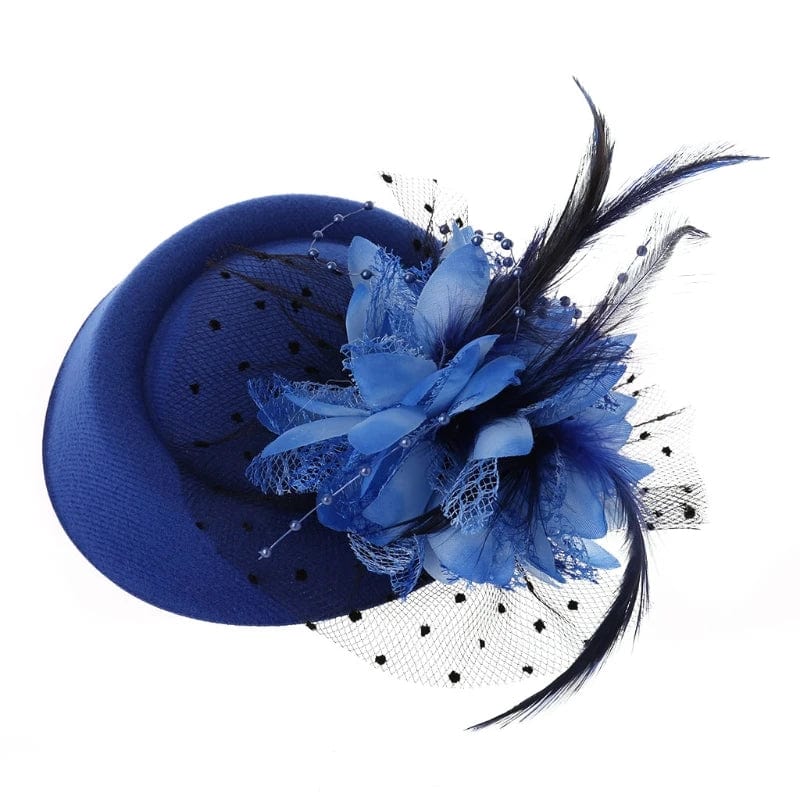 Women's fascinator hat by Showlu Fashion with feather flower decoration, veil, and pillbox style, perfect for cocktail or tea parties.