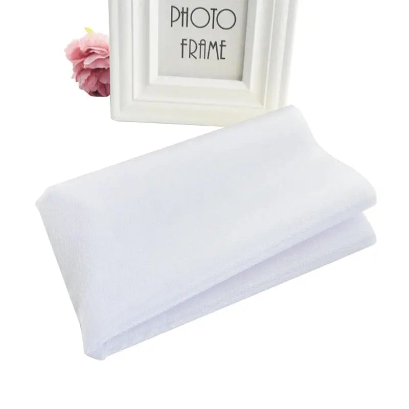 Sheer crystal organza tulle roll for wedding and party decor, showing lightweight, transparent fabric ideal for backdrops and chair sashes.