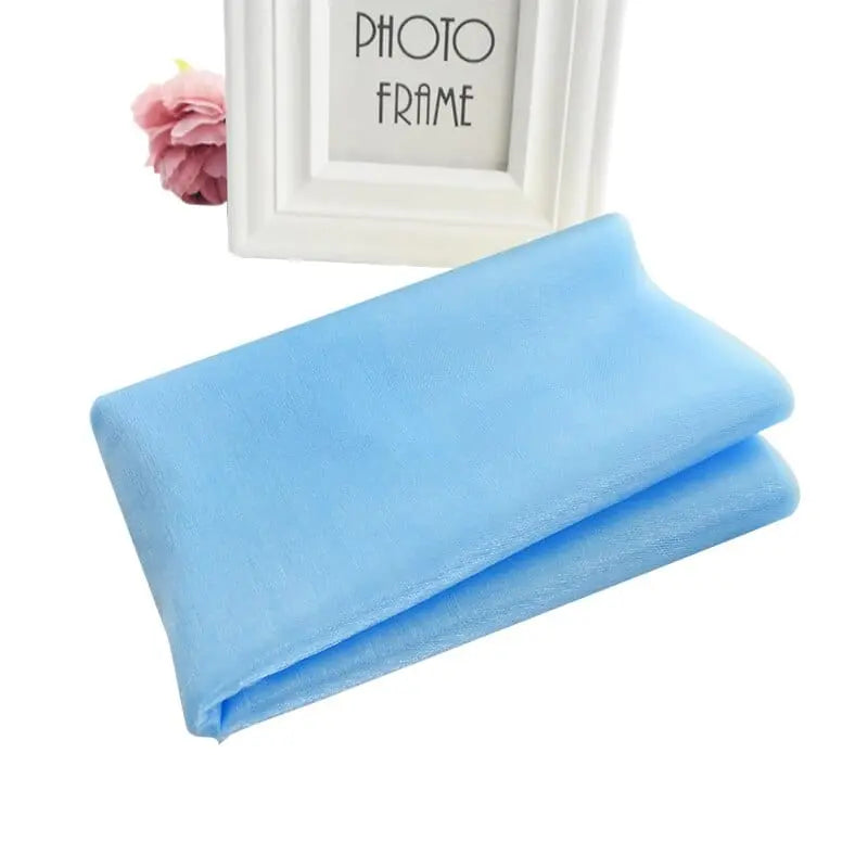 Sheer crystal organza tulle roll for wedding and party decor, showing the lightweight, transparent fabric in 5 or 10 meters.