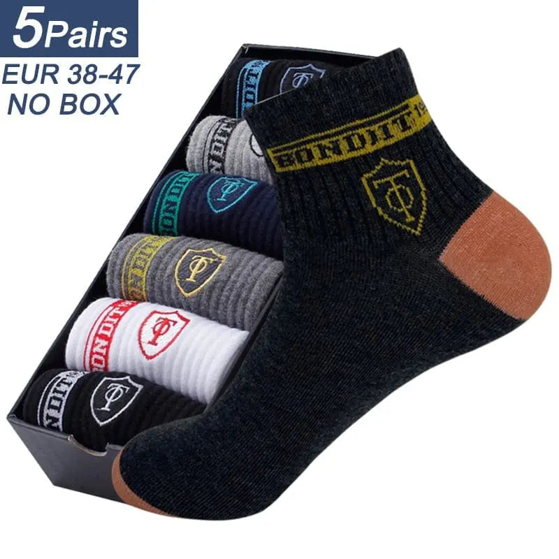 Set of five men's cotton sports socks from Showlu Fashion Store, breathable crew socks ideal for summer and sports activities.