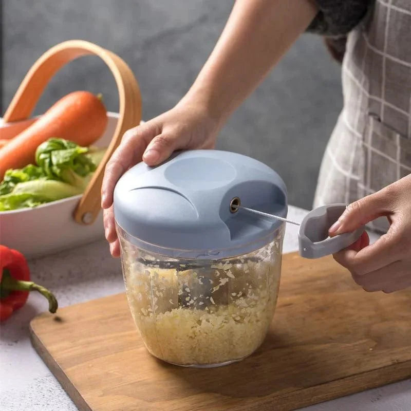 Showlu manual meat mincer and garlic chopper with 500/900ml capacity, featuring a rotating garlic press and vegetable cutter for kitchen use.