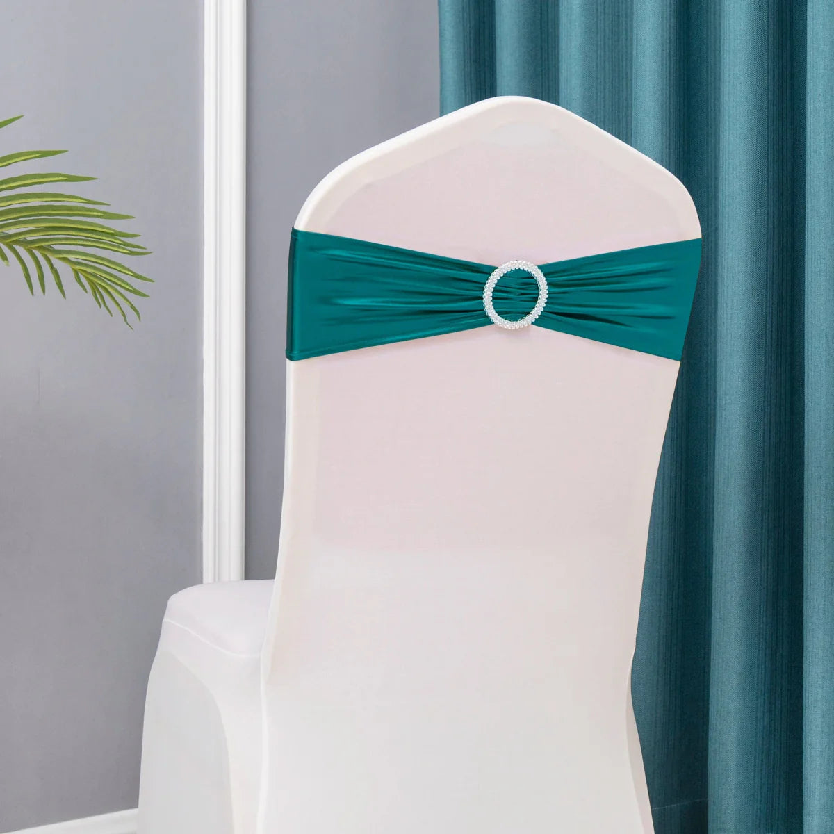 Set of 50 metallic gold and silver spandex chair sashes with buckles for wedding and party decorations.