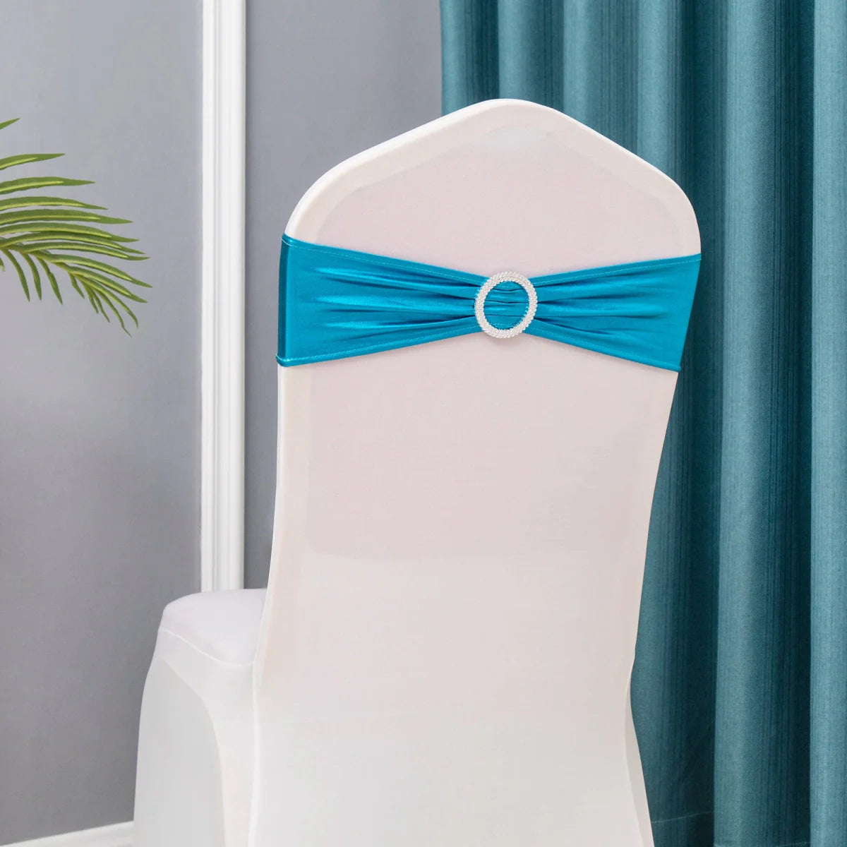 Set of 50 metallic gold and silver spandex chair sashes with buckles for weddings and party decorations.