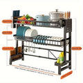 Stainless steel dish storage rack by SHOWLU FASHION STORE, expandable sink drainer for drying dishes in the kitchen.