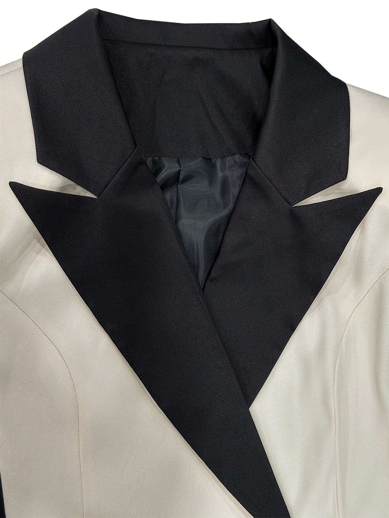 SHOWLU Women's asymmetrical two-tone color-block blazer jacket with stylish, modern design and fitted silhouette.
