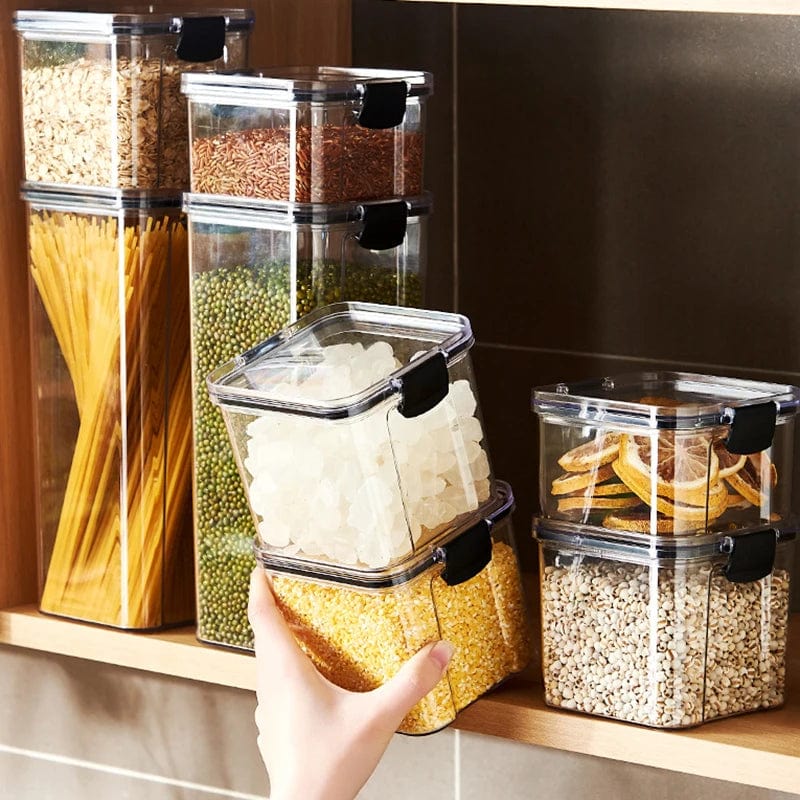 Showlu 5-piece acrylic kitchen grain storage jars set with large sealed tanks for organizing spices, grains, and dry foods.