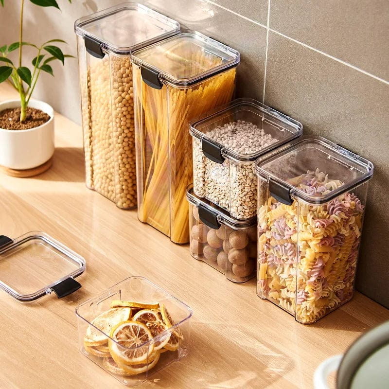 Showlu 5-piece acrylic kitchen grain storage jars set with large sealed tanks for organizing spices, grains, and household essentials.