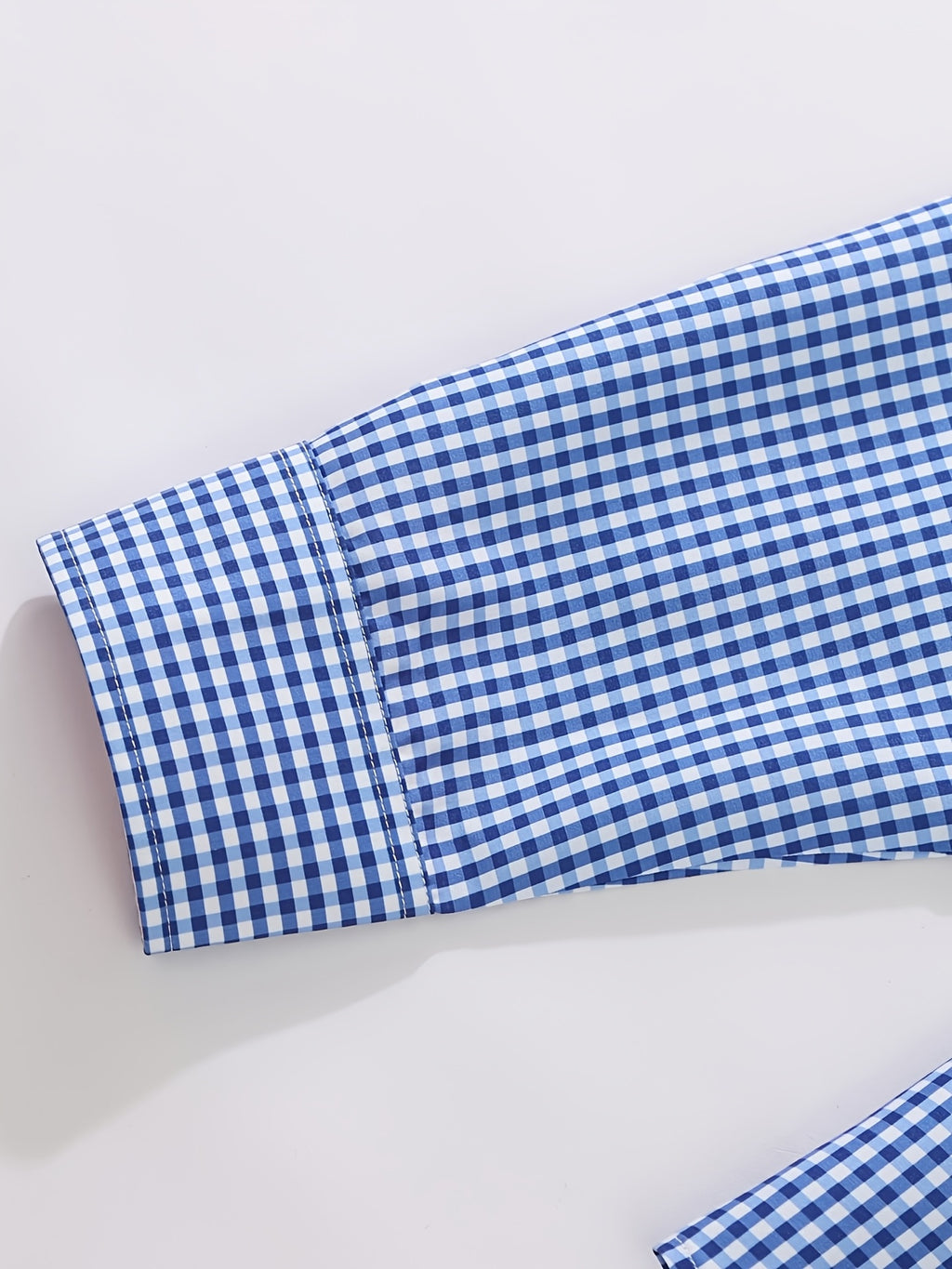 Showlu men's 2-piece summer casual short-sleeve button-up shirt set displayed on a hanger with lightweight fabric and stylish design.