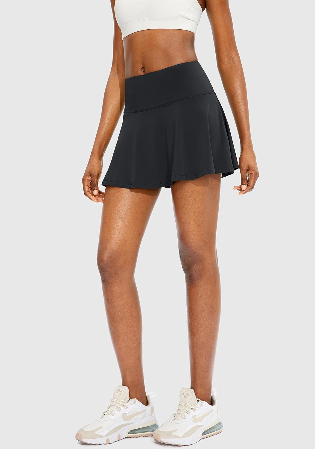 Showlu Smart General women's pleated tennis skirt with four pockets, featuring a stylish design suitable for active tennis wear.