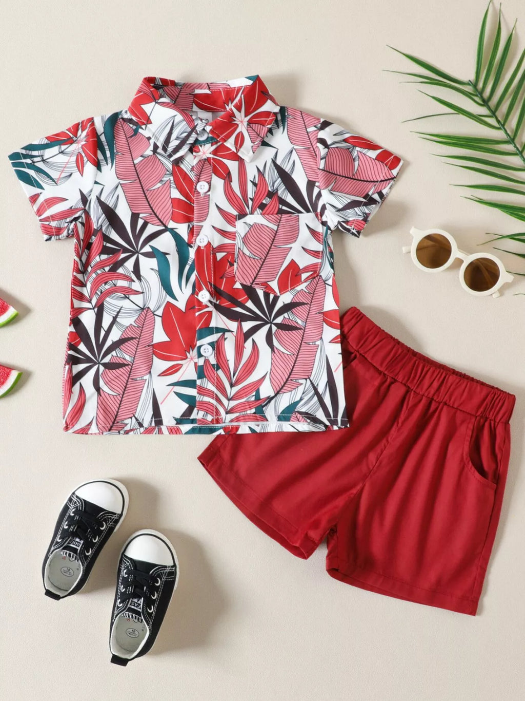 Children's tropical leaf print shirt and shorts set by Trendsi, featuring vibrant green leaf patterns on lightweight fabric.
