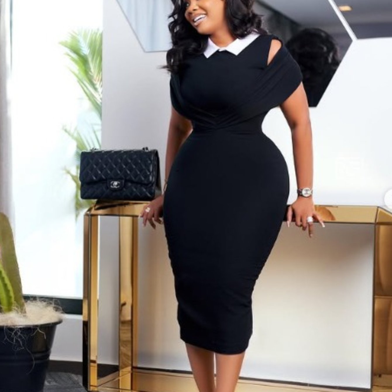 SHOWLU sleeveless cross-strap bodycon dress with high gloss skirt, featuring a fitted silhouette and stylish design.