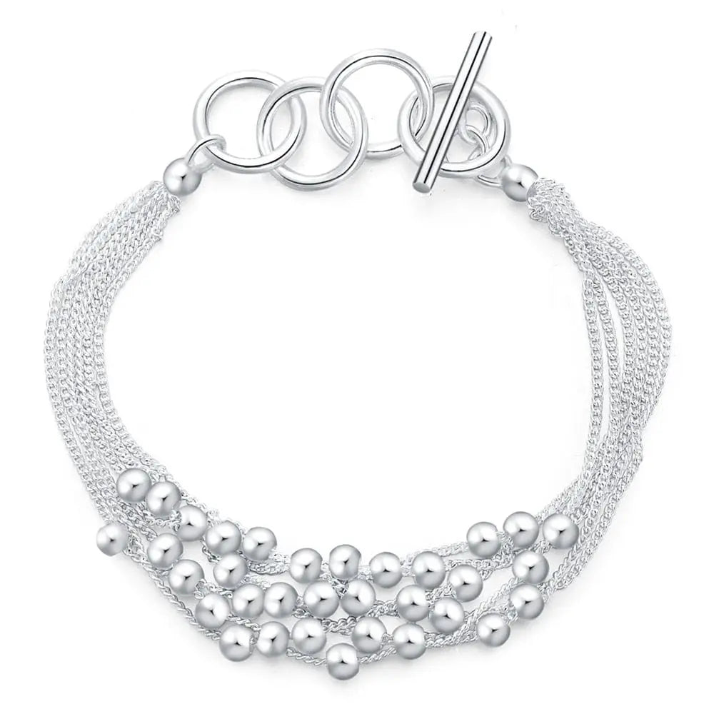 18K gold and sterling silver Anel Demosthene sideways chain bracelet, 8 inches, 5mm wide, unisex jewelry for fashion or special occasions.