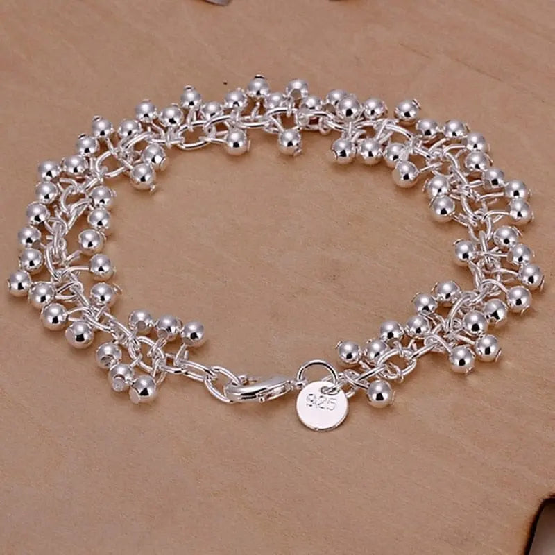 An 8-inch 18K gold sideways chain bracelet with 5mm links, crafted in sterling silver, suitable for women and men.