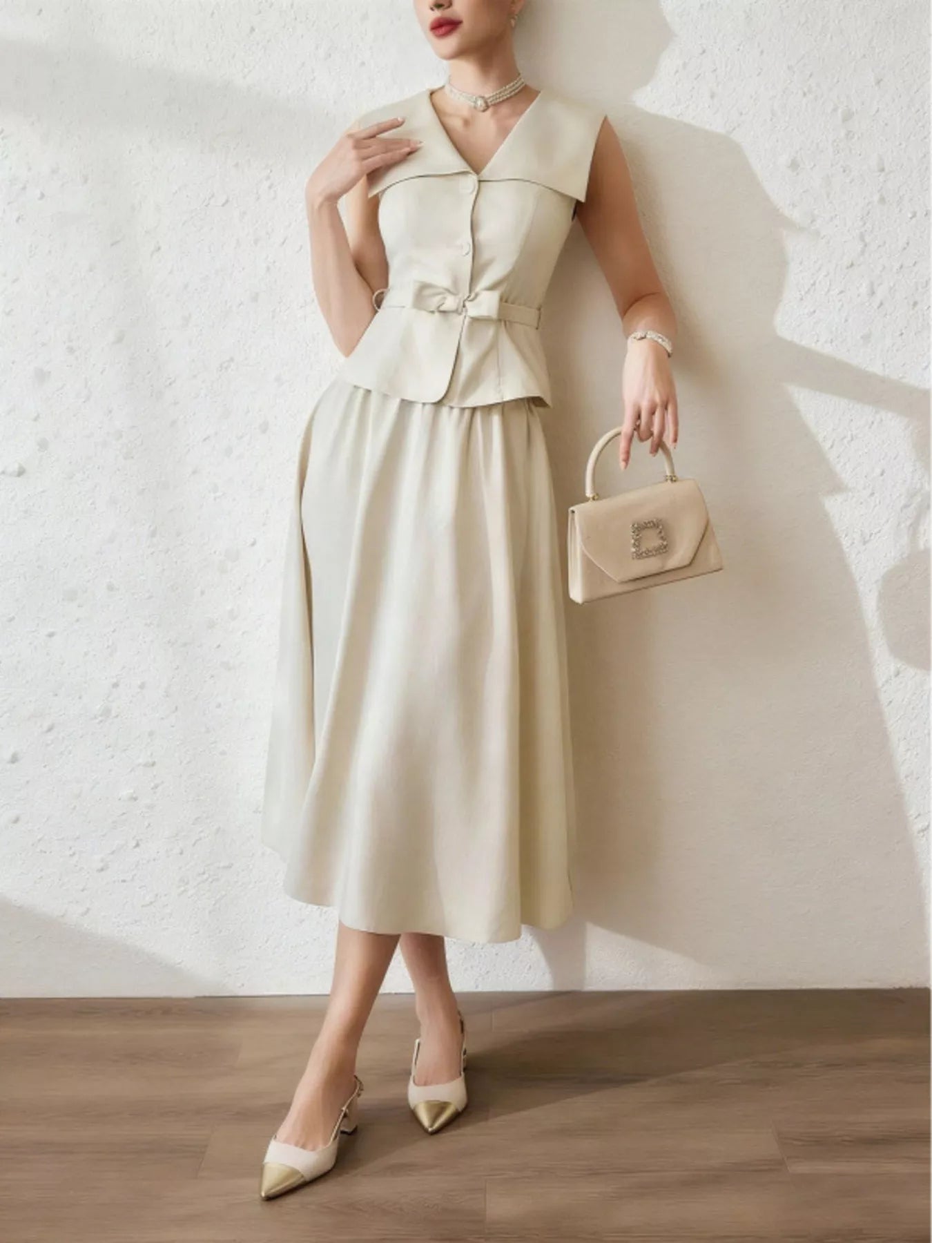 Sleeveless top and midi skirt set by Trendsi, featuring a stylish, coordinated outfit with a sleeveless top and flowing midi skirt.
