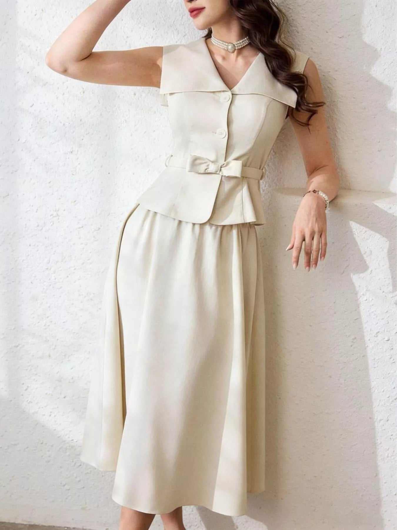 Sleeveless top and midi skirt set by Trendsi, featuring a stylish coordinated outfit in soft fabric, perfect for casual or dressy occasions.