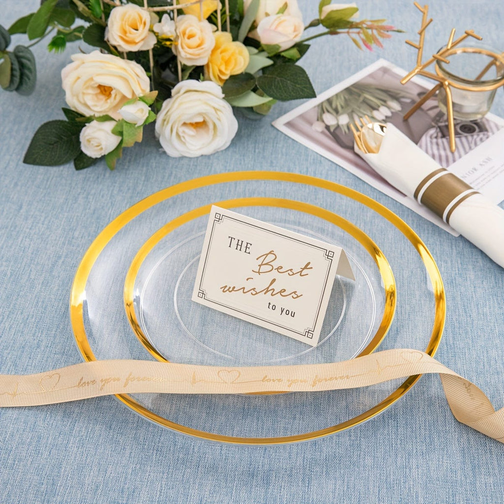 Showlu 840-piece gold plastic dinnerware set with clear plates and cutlery, disposable and ideal for large gatherings.