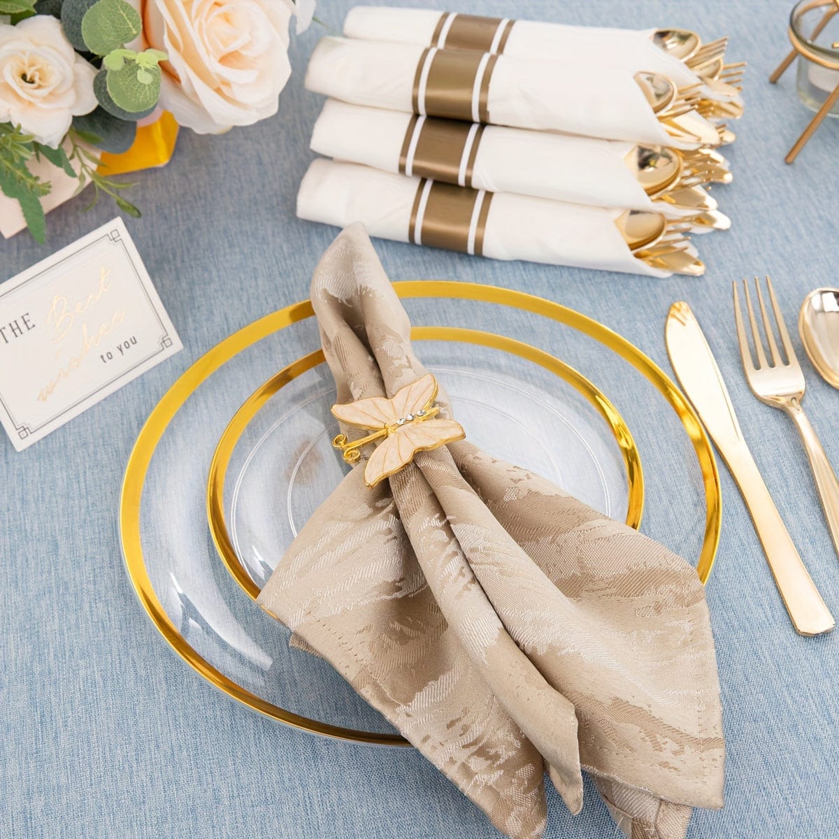 Showlu 840-piece gold plastic dinnerware set with clear plates, gold trim, and wrapped disposable cutlery for gatherings.