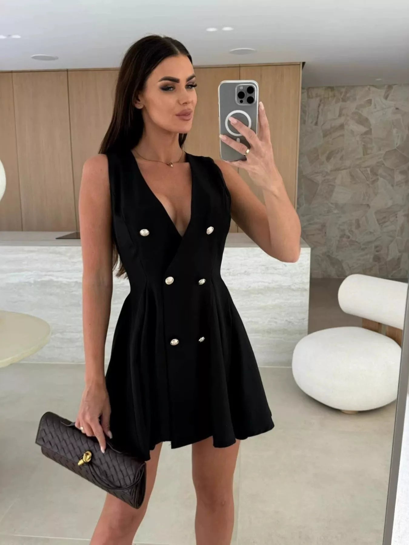 Double-breasted V-neck mini dress by Trendsi featuring a fitted silhouette and stylish design, shown on a model.