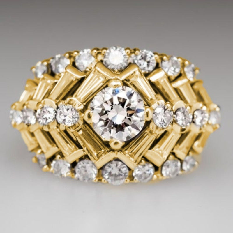 SHOWLU 14K gold-plated wide carved ring with white zirconia inlay, featuring intricate design and sparkling gemstone accents.