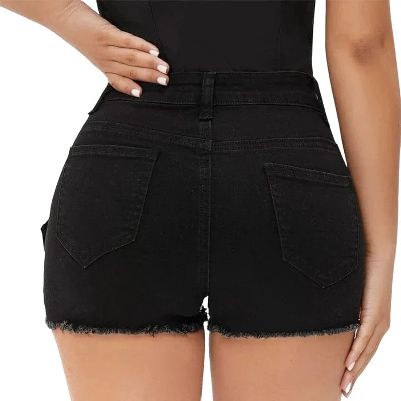 Showlu Women's low waist cut out denim shorts with open hips, fitting skinny hot pants style for summer beachwear and casual wear.
