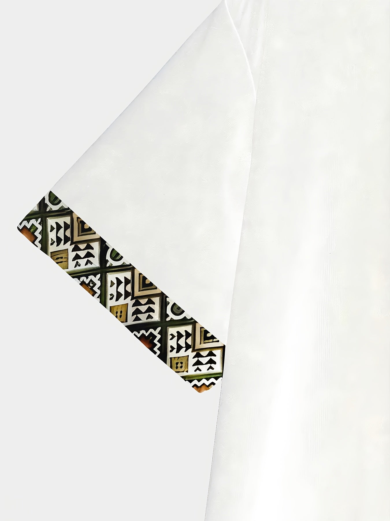 White SHOWLU Men's geometric print T-shirt with polyester fabric, regular fit, featuring bold geometric patterns on the front.