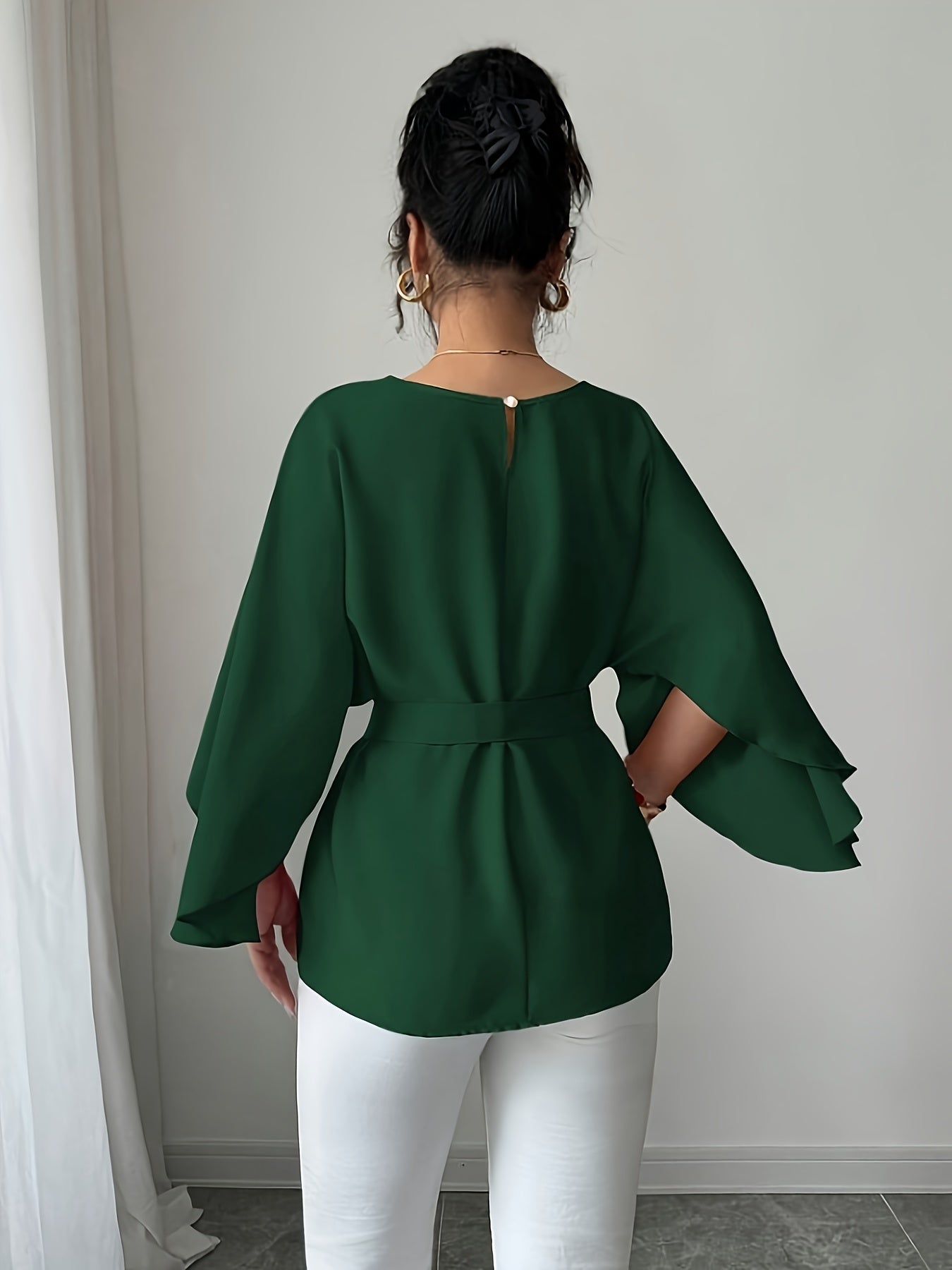 Light blue SHOWLU FASHION long sleeve belted blouse with crew neck, elegant and stylish, perfect for casual or office wear.