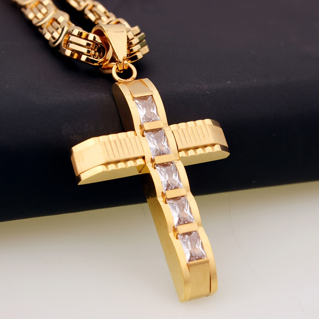 Showlu men's cross pendant necklace, 14K gold plated stainless steel, detailed religious jewelry, hanging from a chain.