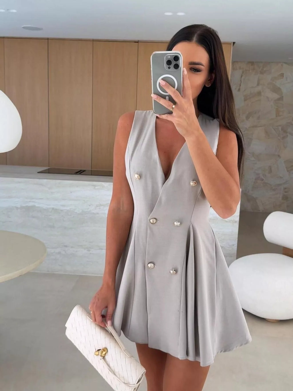 Double-breasted V-neck mini dress from Trendsi featuring a fitted silhouette and stylish design in a versatile color.