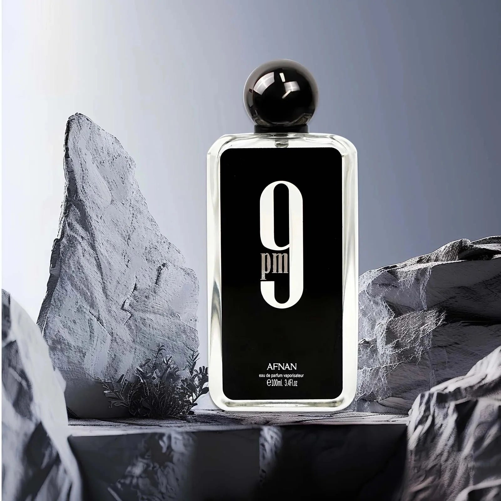 Afnan 9PM men's Eau de Parfum bottle with spicy scent, 3.4 oz, showcasing sleek packaging and design.